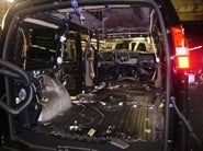 Interior view of a stripped van during conversion process